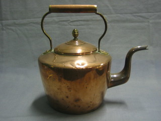 A Victorian copper kettle with brass acorn finial