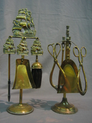 2 brass fireside companion sets and a toasting fork