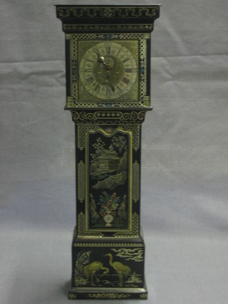 A Huntley & Palmer biscuit tin in the form of a longcase clock 11 1/2"