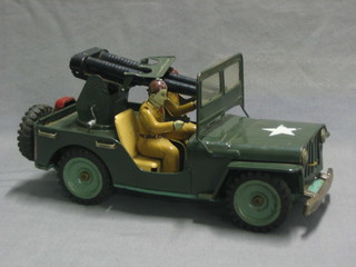 A tin plate model a Jeep with mounted machine gun and 2 soldiers