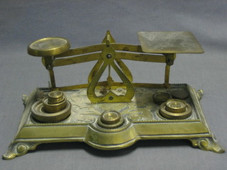 A pair of Art Nouveau brass letter scales