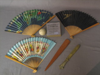 A wooden letter opener made from teak from HMS Warrior, 3 wooden fans, a brass letter opener, a collection of various glass slides and an old leather covered ball