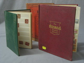A red standard photograph album and a red Royal postage stamp album and a green stock book