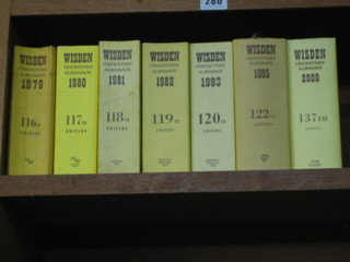 7 editions of Wisden's Cricketing Almanac 1979 - 1983, 1985 and 2000