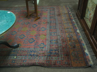 An Afghan red ground rug 120" x 81"