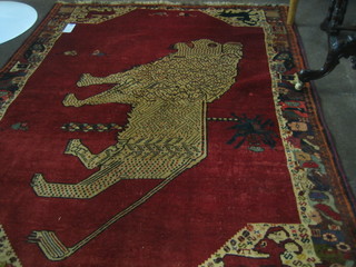 A Gabbeh red ground rug decorated a lion 74" x 60"