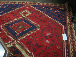 A contemporary Persian Shiraz red ground rug 92" x 60"