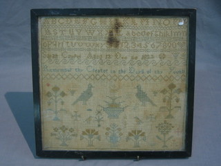 An 18th/19th Century stitch work sampler with alphabet, birds and trees 10" x 11" (faded and stained)