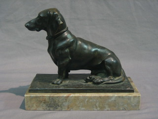An Art Deco bronze figure of a seated Dachshund raised on a marble base, signed 8"