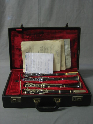A pair of Carl Fisher Boehm Clarinets in A  cased, complete with various bills and paper work relating to both instruments