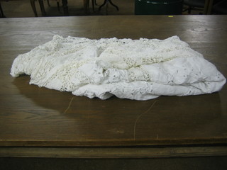 A large white lace table cloth