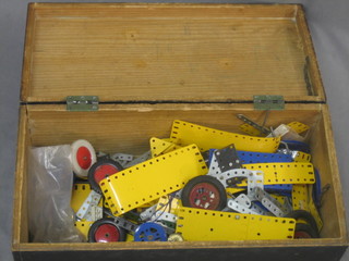 A quantity of various yellow and blue Meccano