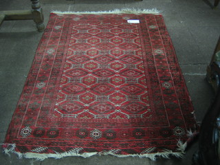 A red ground Bokhara carpet with 18 octagons to the centre 57" x 40"