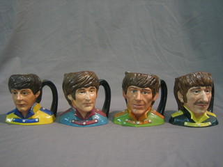 A set of 4 Royal Doulton character jugs depicting The Beatles, the base marked D6726, modelled by Stanley James Taylor, Royal Doulton Tableware 1984