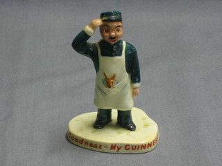 A Carltonware Guinness figure in the form of a standing gentleman wearing an apron with Wallaby, base marked My Goodness My Guinness and with red Carltonware mark   4"