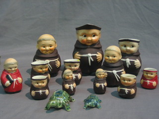 4 Goebel graduated jugs in the form of monks together with a ditto money box, mustard pot and other Goebel monks together with 2 Wade tortoises 