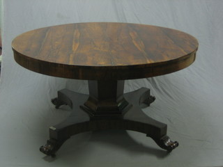 A William IV rosewood circular snap top breakfast table, raised on a chamfered column with triform base 53"