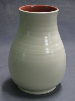 A Poole Pottery pink and white glazed club shaped vase, the base marked Poole Pottery with Dolphin mark 095 and impressed 438 6 1/2" high