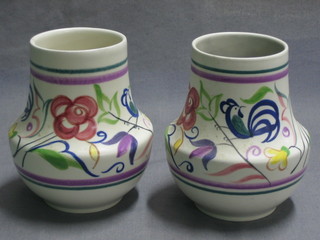 A pair of Poole Pottery squat shaped vases decorated birds amidst branches, base with Dolphin mark 5"