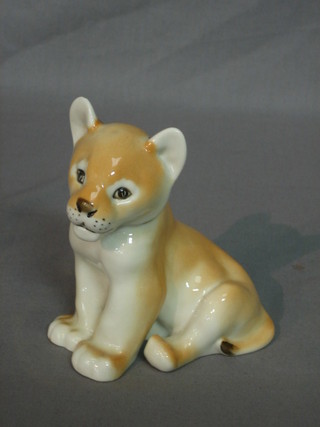 A Soviet Russian porcelain figure of a seated lion cub 4"