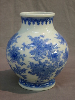 An Oriental blue and white porcelain vase with floral decoration, the base decorated crabs and with 10 character figure mark 7"