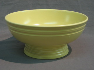 A Keith Murray Wedgwood yellow glazed pedestal bowl, raised on a spreading foot 10"