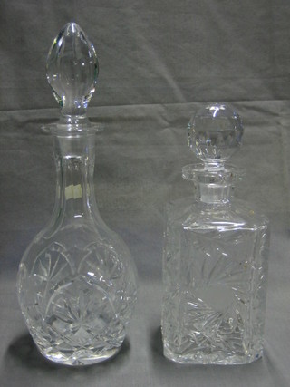 A cut glass spirit decanter and a cut glass club shaped decanter