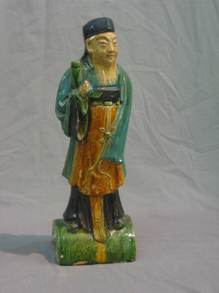 An Oriental pottery ridge tile in the form of a standing sage 17"
