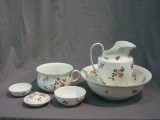 A Bristol semi-porcelain 5 piece floral patterned pottery wash set with wash bowl, jug, chamber pot, soap dish and 1 other dish with floral decoration