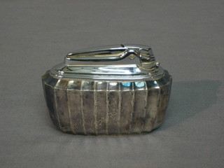 A Ronson silver plated table lighter with demi-reeded decoration