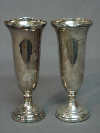 A pair of silver vases, raised on circular spreading bases, Birmingham 1946, 6 1/2"