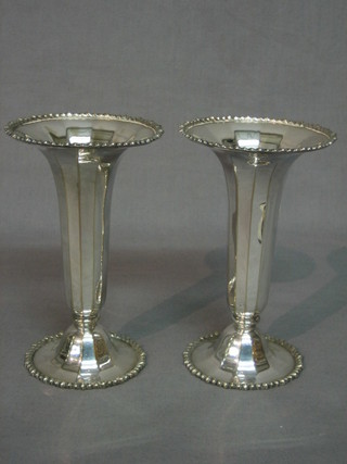 A pair of silver plated trumpet shaped vases with bead work decoration 6"