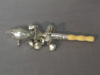 A Georgian silver baby's rattle with whistle and 2 rows of 10 bells, complete with ivory teething bar, London 1815