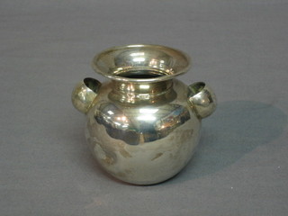 A circular Peruvian silver twin handled urn, the base marked 900 Fekeda 4 ozs