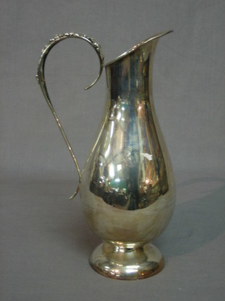A Peruvian silver jug with pierced handle, the base marked 925 Opais Peru, 10 ozs
