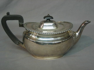 A Georgian style oval Britannia metal teapot