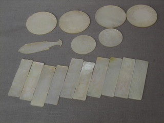 6 circular carved mother of pearl game counters, 10 rectangular ditto and 1 other in the form of  a fish