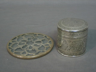 An Eastern engraved silver jar and cover and a glass and silver teapot stand