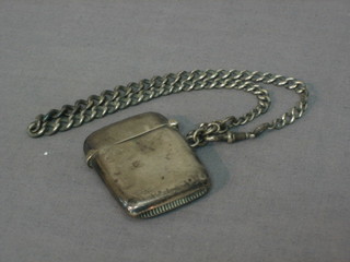 A silver vesta case, Birmingham 1912 and a silver curb link watch chain