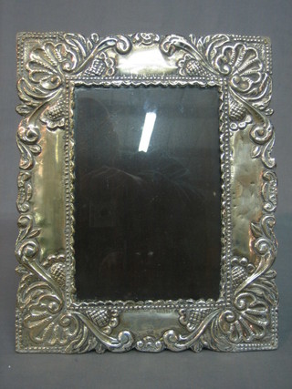 An embossed Peruvian silver easel photograph frame 12" x 10"