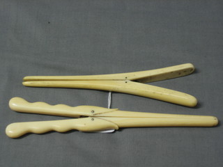 2 pairs of ivory glove stretchers