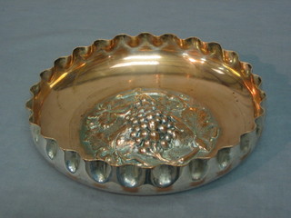 A circular embossed silver plated bowl with vinery decoration 9"