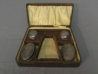A pair of childs silver backed miniature hair brushes and a pair of circular rouge pots with silver lids, London 1925, cased
