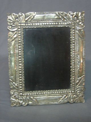 A Peruvian embossed silver easel photograph frame 14" x 11"