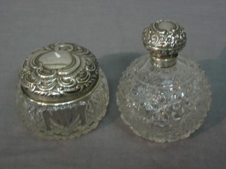 A cut glass dressing table jar with silver lid 3" and a globular scent bottle with hinged lid and silver collar