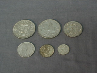 A George V 1917 florin, a George V 1935 crown, a George VI 1937 crown, do. half crown, do. 2 shilling piece and do. shilling piece