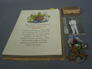A posthumous group of 5 medals to Chief ERA Edward George Fowler Royal Navy (lost at sea) comprising 1939-45 Star, Atlantic Star, Italy Star, British War medal and Victory medal together with presentation scroll, photograph of the recipient in uniform and original box of transmission and a pendant