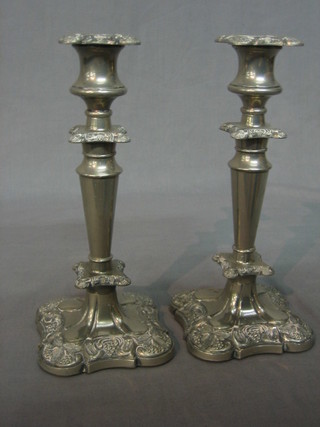 A pair of silver plated candlesticks 5"