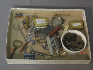 A collection of various pocket knives, curios and coins