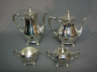 A 4 piece silver plated tea/coffee service comprising teapot, coffee pot, twin handled sugar bowl and a cream jug